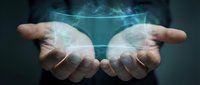 Two open hands holding glowing digital sphere with network connections and light effects, representing technology, innovation, data transfer, and future business solutions.