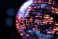 Glowing disco ball with colorful light reflections creating festive atmosphere for nightclub, party or entertainment event.