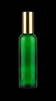 Green glass bottle with gold cap isolated on transparent background, ready for cosmetic, skincare, and fragrance product design use on packaging, labels, and print-on-demand materials.