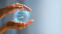Female hands holding glowing digital sphere displaying optimal levels graph and bar chart, representing data analysis, business growth, performance metrics, and technology innovation concept.