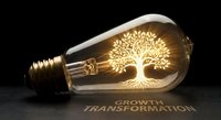 Vintage Edison bulb with glowing tree of life filament symbolizing growth and transformation on dark background for creative business concepts.