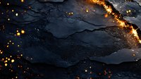 Dark textured stone or slate background with glowing golden sparks and light trail effect, creating dramatic contrast between rough surface and luminous elements.