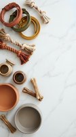 Earthy ceramic bowls and rope tassels arranged on marble surface for boho home decor and artisan pottery styling projects.