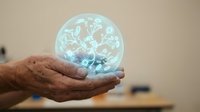 Elderly hands holding glowing digital earth globe with network connections, representing global technology, communication and worldwide connectivity.
