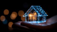 Glowing holographic house floating above open palm with blue light particles and bokeh background, representing smart home technology and digital innovation.