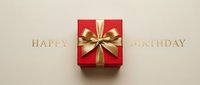 Red gift box with golden bow centered between Happy Birthday text on beige background, elegant celebration concept for cards and banners.