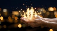 Hands holding glowing family silhouettes with magical light effects and golden bokeh background for insurance and protection concepts.