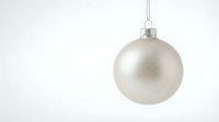 Elegant silver Christmas ornament ball hanging against clean white background for holiday decorations and festive seasonal designs.