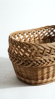 Handwoven wicker basket with intricate braided rim detail on white background, traditional craftsmanship for home storage and organization decor.