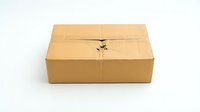 Brown cardboard shipping box with tape seal isolated on white background for packaging and delivery concepts.