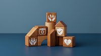 Wooden blocks with white icons including hearts, hands, and checkmarks arranged on blue background for business concepts and teamwork presentations.