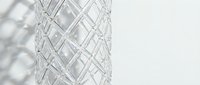 Crystal cut glass vase with intricate diamond pattern design showcasing elegant geometric textures and light reflections for luxury home decor.