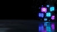 Digital communication icons with neon glow effects floating above circuit board background. Social media symbols including chat, email and notification bells.