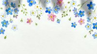 Colorful pressed flowers and green leaves arranged on white background, isolated design element suitable for greeting cards, invitations, and decorative projects.