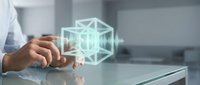 Businessman touching holographic wireframe cube interface on glass table in modern office environment for technology and innovation concepts.