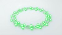Green glowing chain links forming circular pattern with luminous nodes on white background isolated for digital design and technology concepts.