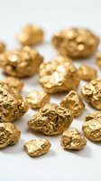 Raw gold nuggets scattered on white background showing natural metallic texture and irregular shapes for mining and precious metals concepts.