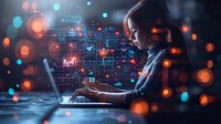 Young Asian female professional working on laptop with futuristic digital interface overlay, glowing bokeh lights create cybersecurity and artificial intelligence concept perfect for tech innovation.