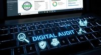 Digital audit concept with glowing icons on laptop keyboard showing financial compliance dashboard and analytics charts for business technology solutions.