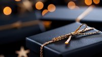 Elegant black gift box with golden twine bow against blurred bokeh lights background, creating festive holiday atmosphere. Luxury present packaging concept.