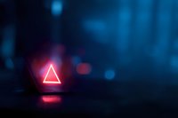 Glowing neon triangle sign illuminating dark blue atmospheric background with bokeh light effects, creating futuristic cyberpunk ambiance.