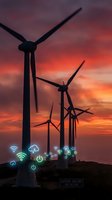 Wind turbines silhouetted against dramatic sunset sky with digital technology icons representing smart grid and renewable energy innovation.