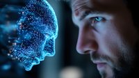 Young Caucasian man with beard gazing at glowing digital brain hologram with particle effects representing artificial intelligence and neural networks in technology.