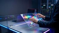 Businessman using futuristic holographic interface with colorful data visualization and charts in modern office at night for business analytics.
