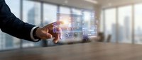 Businessman hand touching futuristic holographic interface with digital data analytics dashboard in modern office environment for technology presentations.