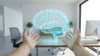 Hands presenting holographic brain projection in modern office workspace for artificial intelligence and neuroscience concepts.