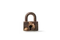 Old rusty padlock with keyhole isolated on white background, showing weathered metal texture and aged patina. Security concept for design projects.