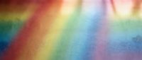 Abstract rainbow gradient background with soft blurred colors transitioning from red to violet creating dreamy atmospheric effect for creative projects.