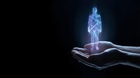 Glowing blue holographic human figure floating above open hands on dark background for medical technology and healthcare innovation concepts.
