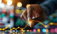 African American businessman pointing at glowing financial chart graph showing market growth trend analysis on digital display with bokeh background.