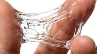 Hands stretching clear slime or gel substance against white background, demonstrating elasticity and texture for sensory play, educational content, or product testing purposes.