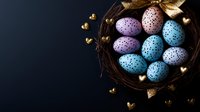 Easter eggs in pastel blue and purple with speckled pattern nestled in dark nest with golden heart decorations against black background, moody holiday composition.