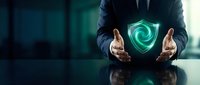 Businessman in dark suit holding glowing green shield symbol, representing cybersecurity, data protection, and digital safety for corporate security concepts.
