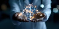 Glowing anatomical torso hologram floating between hands against dark background, representing medical technology and healthcare innovation in modern medicine.