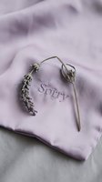 Dried lavender sprigs resting on a soft lilac fabric embroidered with the word Sorry, evoking apology, forgiveness, and gentle emotion.