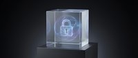 Glowing padlock hologram inside transparent cube on dark background, representing digital security, data protection, and cybersecurity technology.