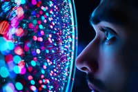 Young woman's profile illuminated by vibrant neon bokeh lights creating magical atmosphere. Close up portrait with blue and pink glowing dots pattern for creative design.