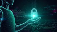Digital security concept with glowing padlock hologram floating above open palm in futuristic cyber environment with circuit patterns and data streams.