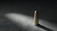 Stack of golden coins creating tower on dark textured surface with dramatic lighting and shadow effects for financial growth concepts.