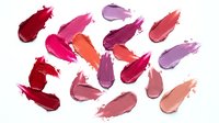 Colorful lipstick smears and makeup swatches isolated on white background. Beauty cosmetics texture samples for fashion and glamour design projects.
