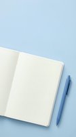 Open notebook with blank cream pages and blue ballpoint pen on light blue background, suitable for stationery, office supplies, education, and business planning concepts.