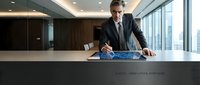 Mature male professional in dark business suit signing digital contract on tablet at modern office desk with city skyline view, representing corporate agreement and technology.