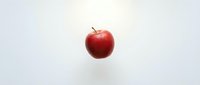 Fresh red apple isolated on white background for healthy eating and nutrition concepts.