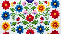 Colorful folk art floral embroidery pattern with vibrant red, blue, yellow flowers and green leaves on white background for textile design.