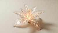 Elegant translucent leaf sculpture with warm golden light glowing from center, creating ethereal botanical art piece for luxury interior design and decor.