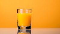 Fresh orange juice in clear glass on reflective surface against vibrant orange background, minimalist drink photography for healthy lifestyle and beverage advertising.
